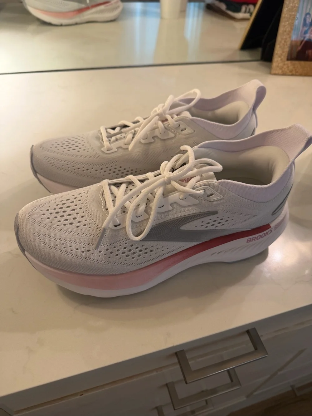 Brooks White Running Shoe with Pink Accent